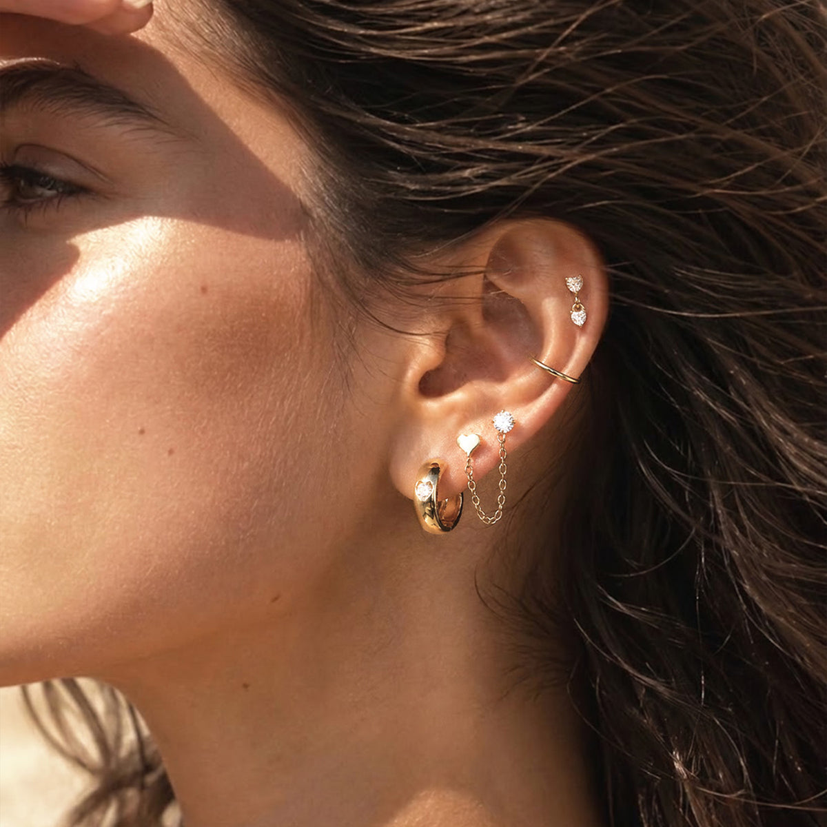 Curated ear wearing Oumo Jewelry piercing jewelry