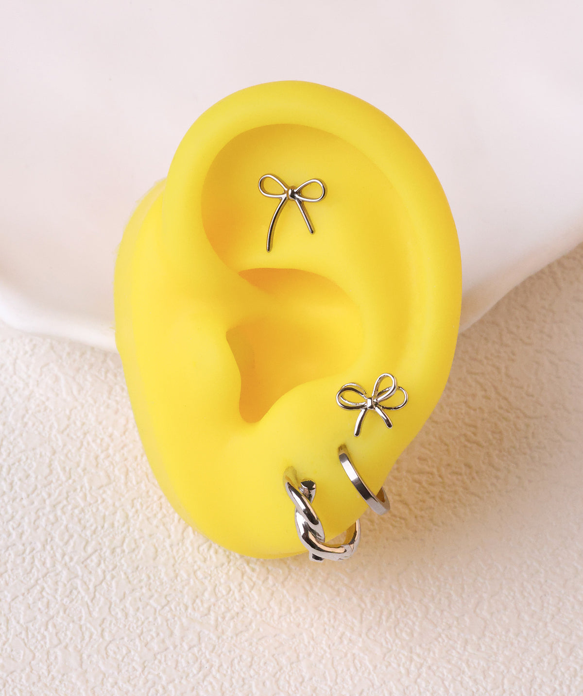 Playful Hollow Bow Flatback Stud - Stainless Steel - Helix, Conch, Flat - Oumo Jewelry